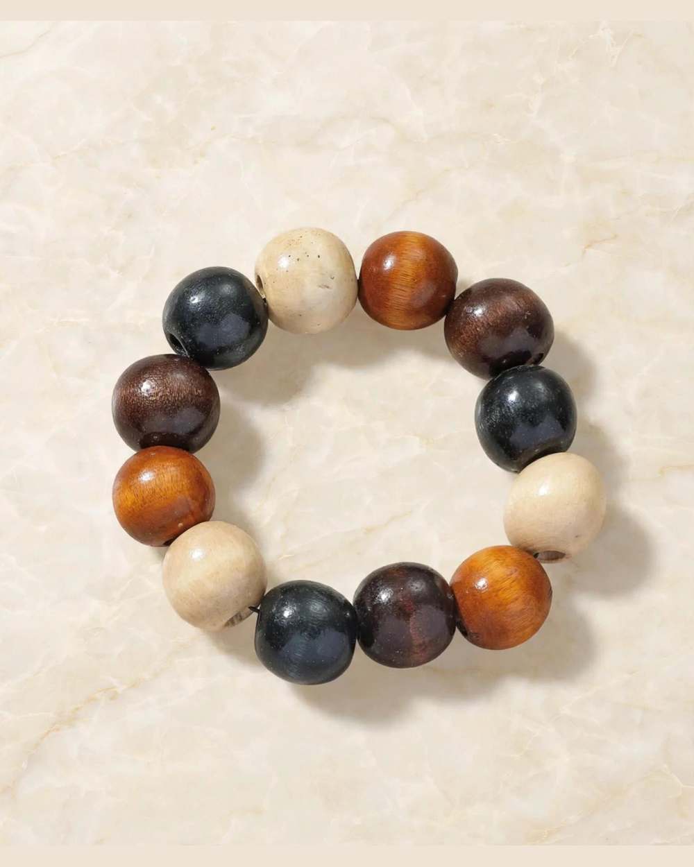 Pulsera elástica de cuentas grandes de madera en negro, marrón y beige